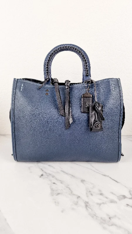 Coach Borough bags with a contrast - stitched handle for a unique lookCoach 1941 Rogue 31 Prussian Blue Western Whiplash Whipstitch with Black Suede Lining Handbag Coach 58122