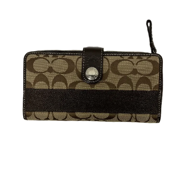 Coach Dempsey bags with a contrast - colored interior for visual interestWallet Designer By Coach, Size: Medium