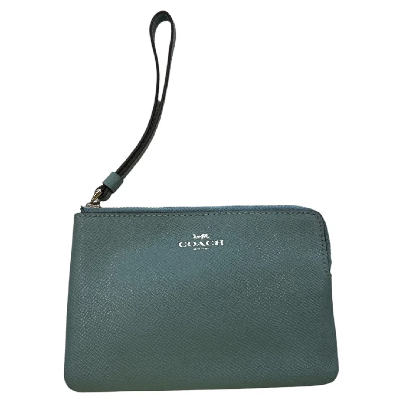 Coach Dempsey bags with a contrast - colored interior for visual interestWristlet Designer By Coach, Size: Small