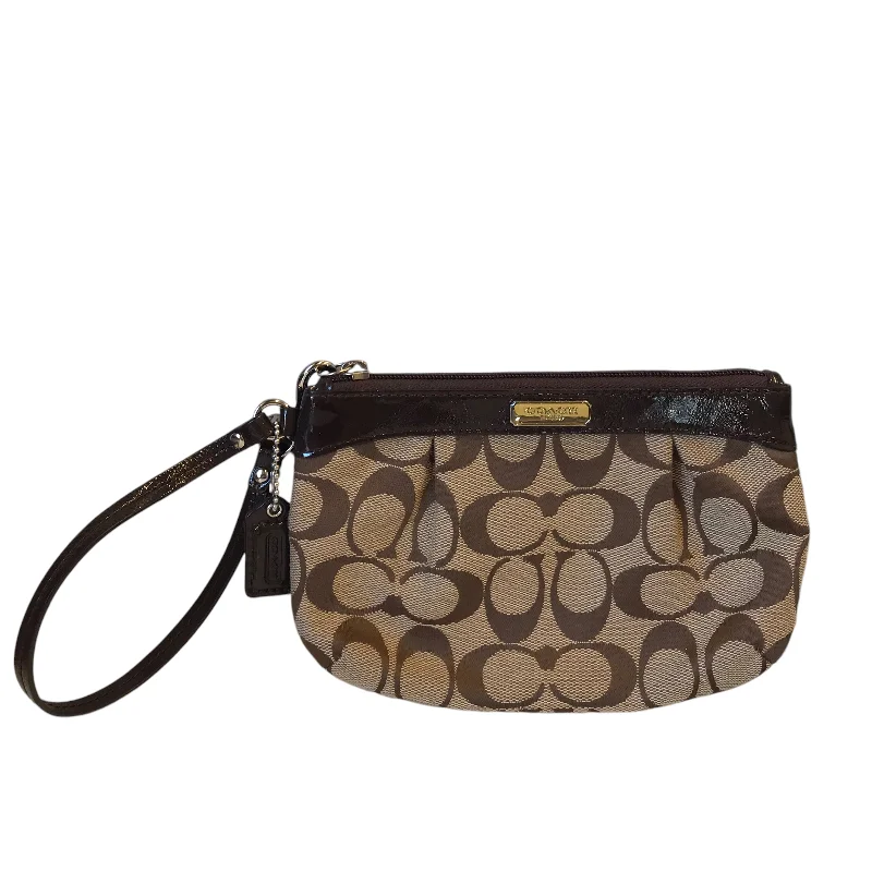 Coach Borough bags with a structured silhouette and a magnetic - snap closureWristlet Designer By Coach In Brown, Size:Medium