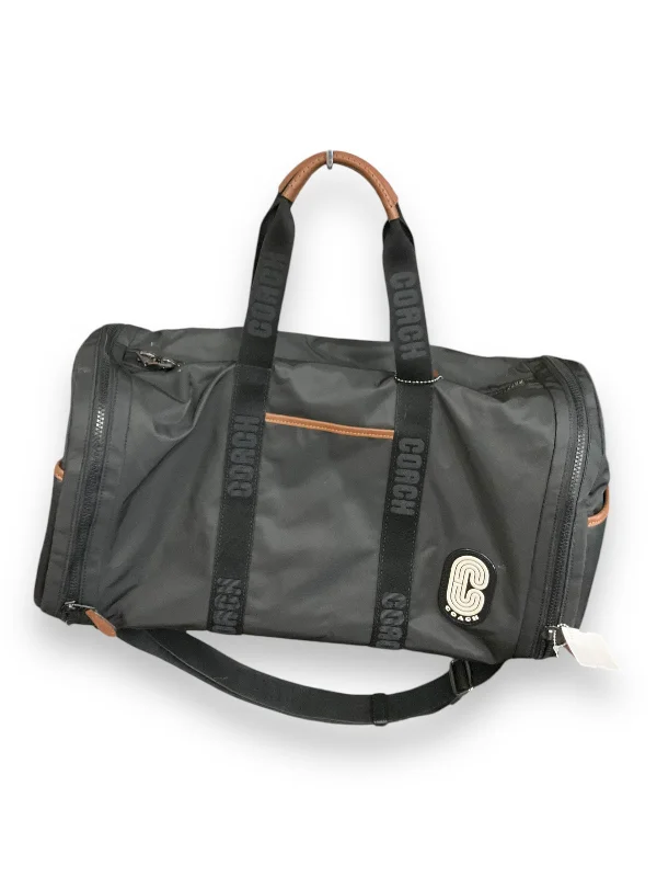 Coach Dempsey bags with a contrast - colored interior for visual interestDuffle And Weekender Designer By Coach, Size: Large