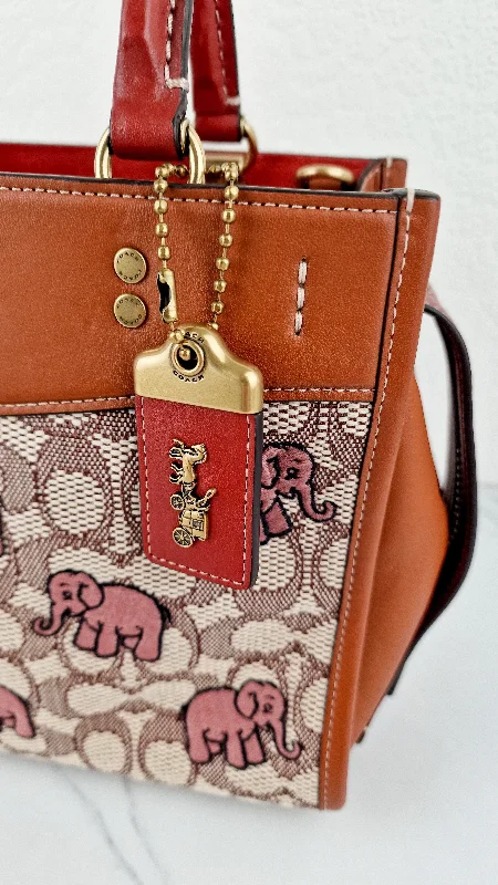 Coach bags with a back - zip pocket for storing valuables securelyCoach Rogue 25 Signature Textile Jacquard with Embroidered Pink Elephants Handbag Coach C6165