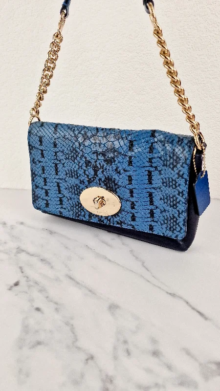 Ladies Coach Borough bags in a pastel shade for a soft and delicate appearanceCoach Crosstown Crossbody Bag in Blue Snake Embossed Leather With Chain Detail & Turnlock